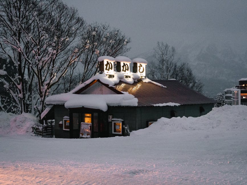 Snow-covered restaurant in snowy winter evening in Niseko Hirafu Hokkaido