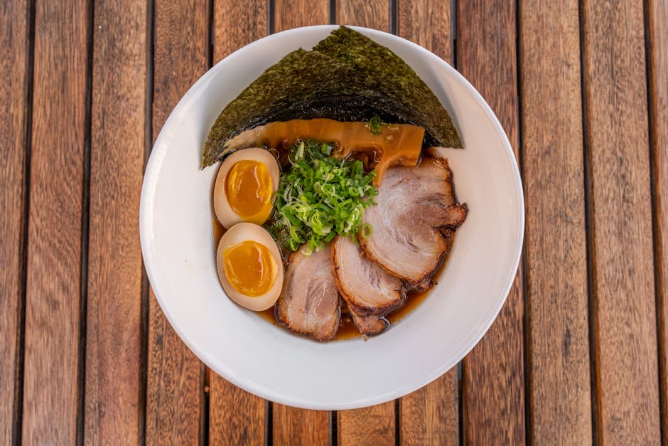 Bowl of shoyu ramen topped with chashu pork nori and eggs