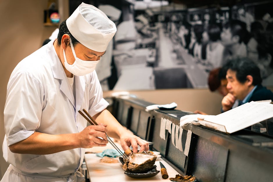 Sushi chef skillfully preparing fresh seafood at a restaurant in Japan