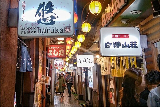 Exploring Hokkaido Nightlife Susukino Evening Walking Tour - The Nikka sign and a famous Sapporo night image