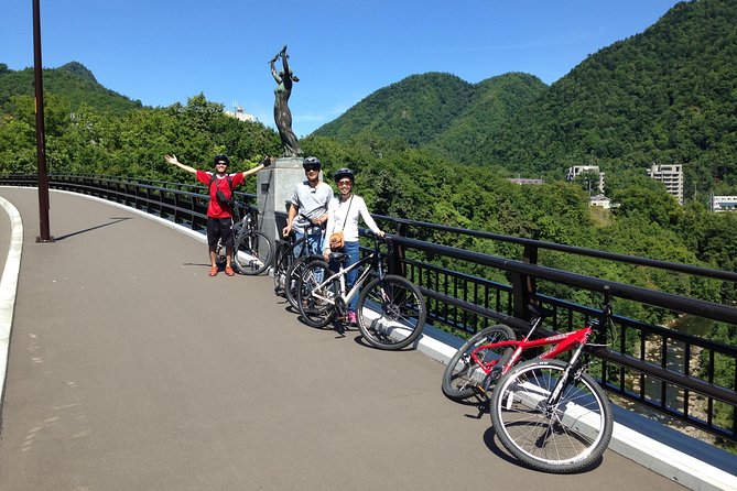 Mountain Bike Tour from Sapporo Including Hoheikyo Onsen and Lunch - Pedaling beside the Toyohira River
