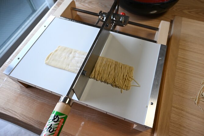 Ramen Making Experience in Sapporo - Step three: flattening and rolling the dough