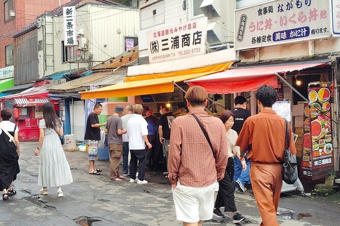 Sapporo: Nijo Market Guided Tour with Seafood Meal - Reading the seafood stalls with a local guide