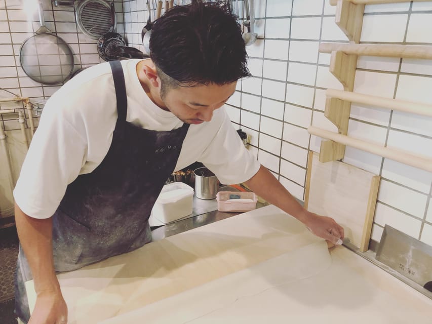 Soba noodle making experience and tempura, Hokkaido sakeplan - Cutting noodles with a Japanese soba knife